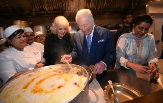 King Charles III and Queen Camilla meet British Muslim women at a female led restaurant and help pack donation boxes ahead of Ramadan, at Darjeeling Express, Kingly Court, Carnaby Street on February 26, 2025 in London, England