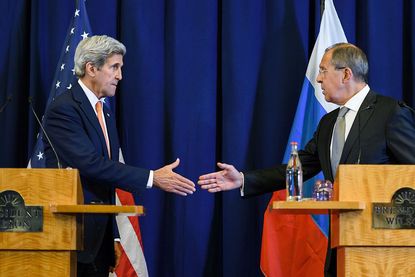 Secretary of State John Kerry and Russian Foreign Minister Sergey Lavrov shake hands while announcing a Syria deal