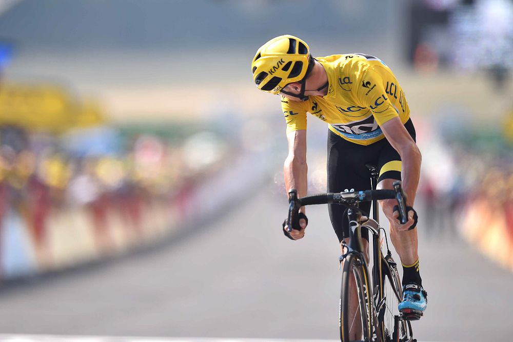 Chris Froome checks the time gaps at the finish.