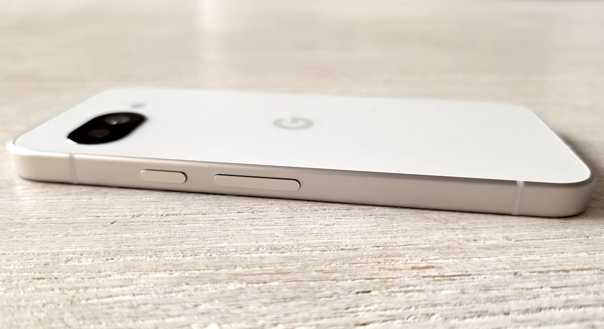 The back of the Google Pixel 9a, lying on a table