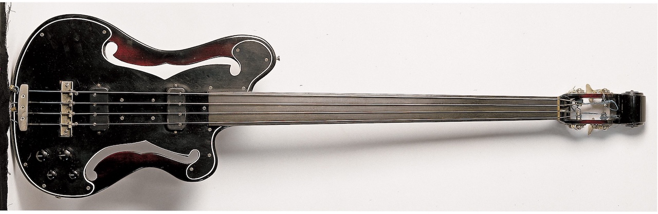 Studio still life of a 1966 Ampeg AUB-1 Fretless Bass guitar, photographed in the United Kingdom.