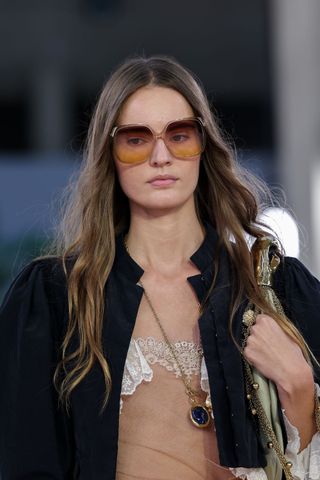 Model at Chloé wearing Chloé-girl waves, a key Spring/Summer 2025 fashion month beauty look