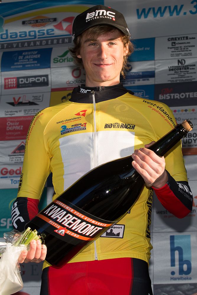 Tom Bohli (BMC) in yello on the Driedaagse van West-Vlaanderen prologue podium