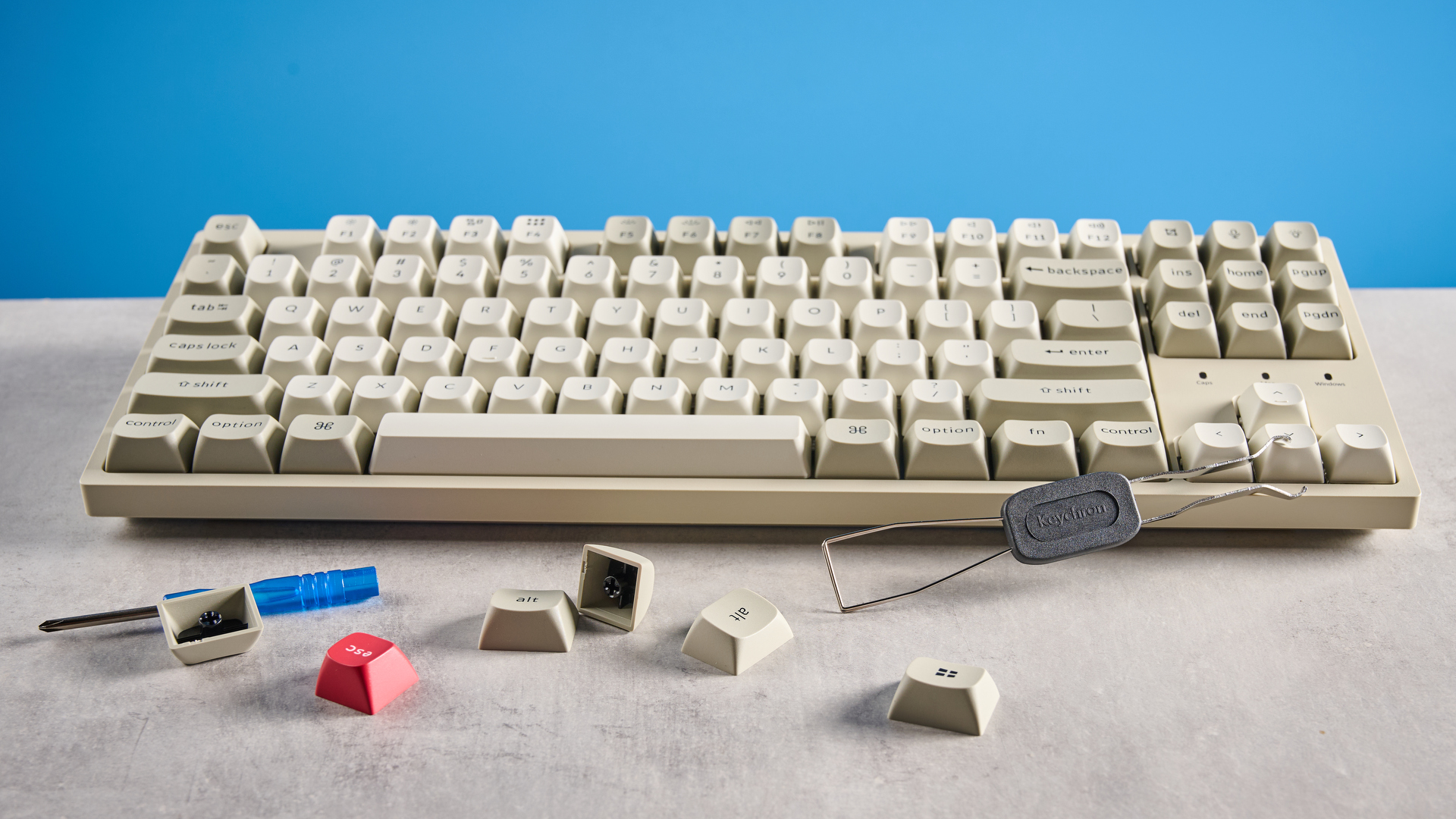 Keychron C1 Pro 8K photographed in front of a blue background. 