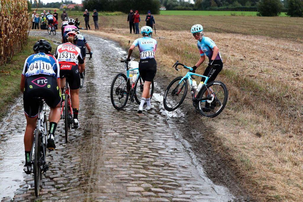 ROUBAIX FRANCE OCTOBER 02 Elizabeth Bennett of United Kingdom and Team DropsLe Col Supported By Tempur and teammate crash through Warlaing Brillon cobblestones sector during the 1st ParisRoubaix 2021 Womens Elite a 1164km race from Denain to Roubaix ParisRoubaixFemmes ParisRoubaix on October 02 2021 in Roubaix France Photo by Bas CzerwinskiGetty Images