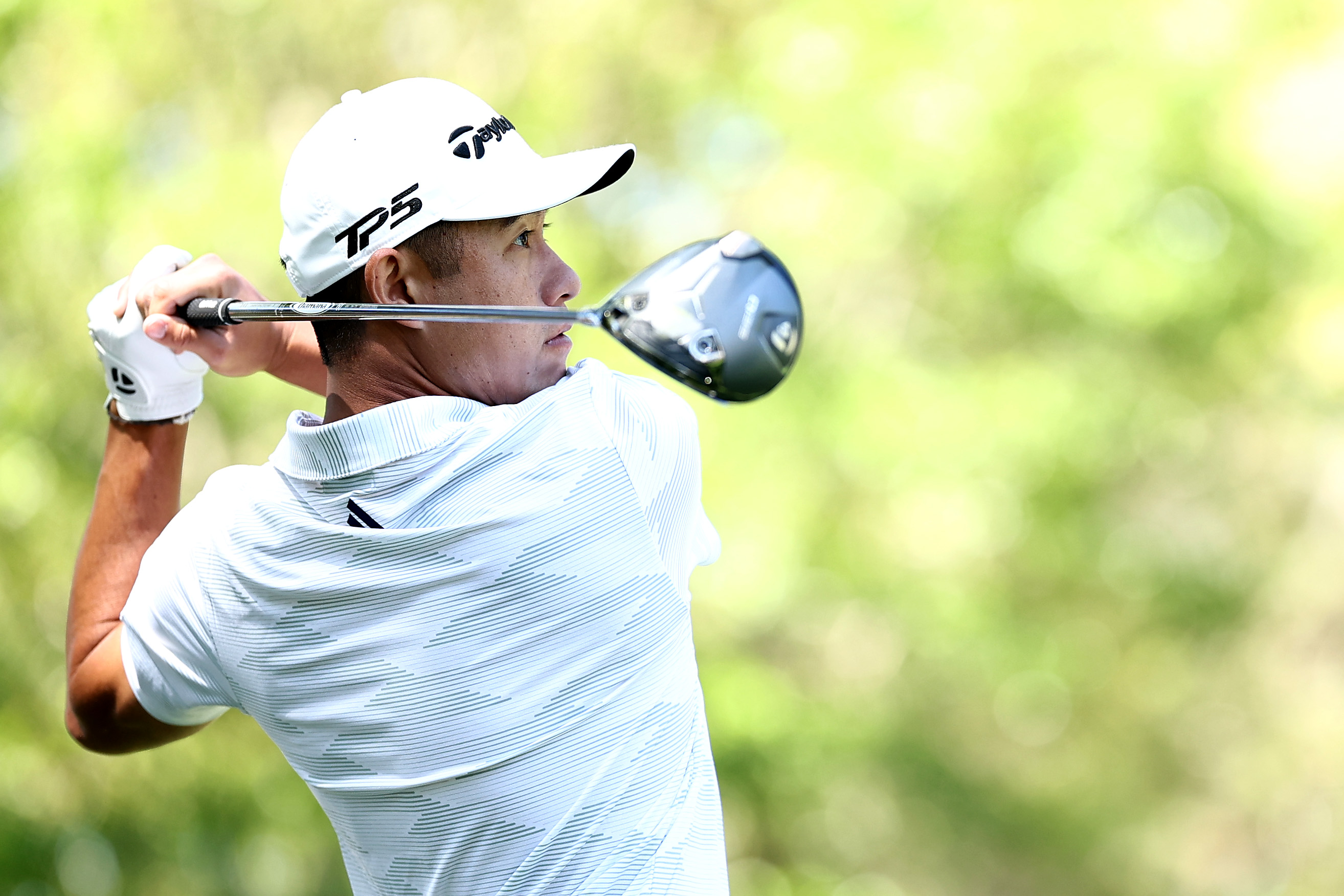 Collin Morikawa using a driver off the tee