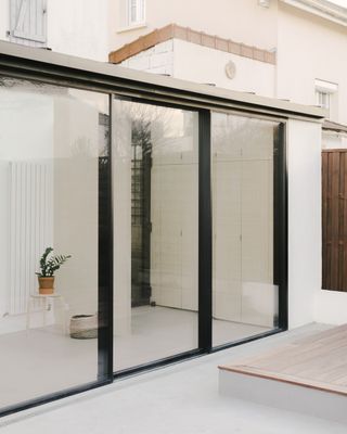 Side view of minimalist french home extension in nanterre