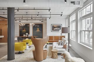 open-plan contemporary interior with brown, cream and yellow furnishings