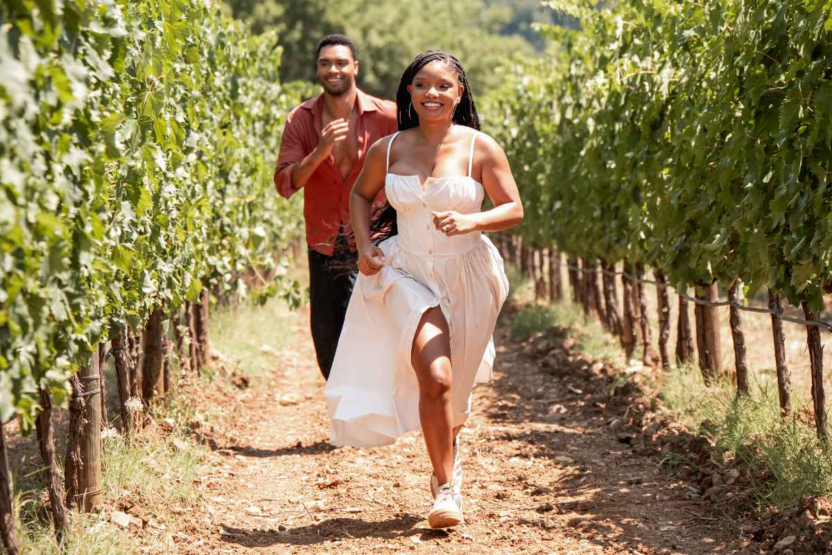 Reg&amp;eacute;-Jean Page chases halle bailey through grape fields at a winery in tuscany in the movie you me and tuscany