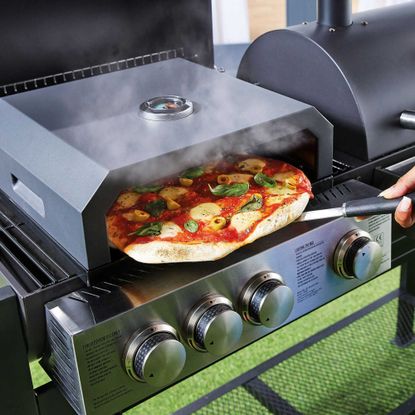 Aldi BBQ pizza oven cooking pizza on grill