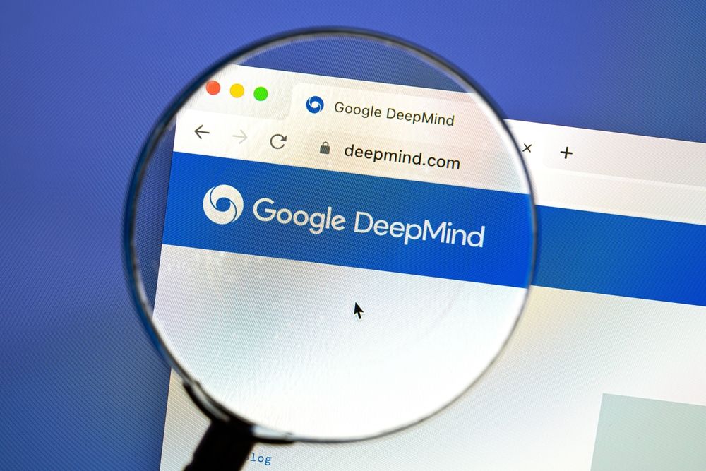 Google DeepMind logo in a web browser seen through magnifying glass lense