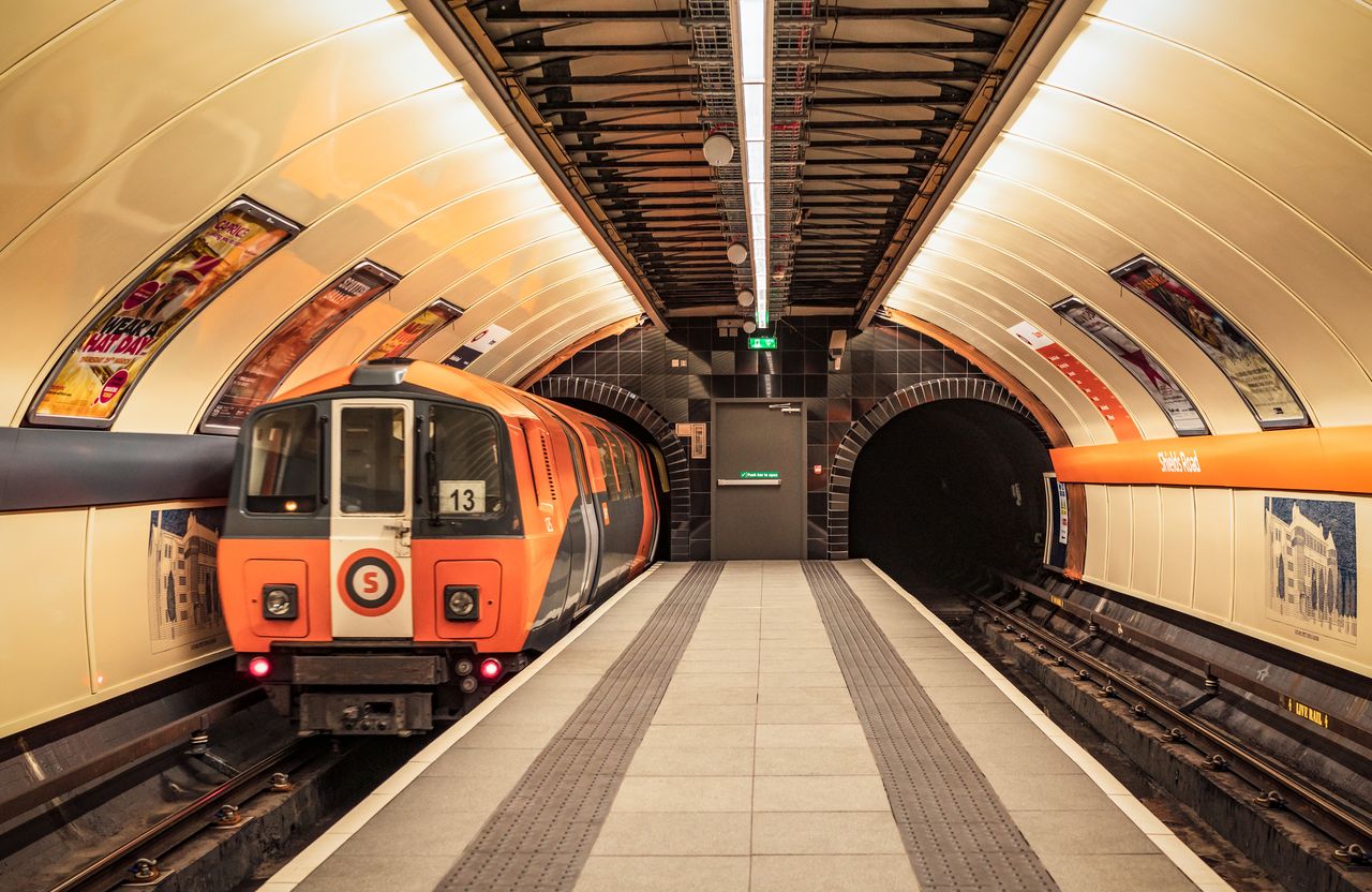 Glasgow Subway train arriving in a station