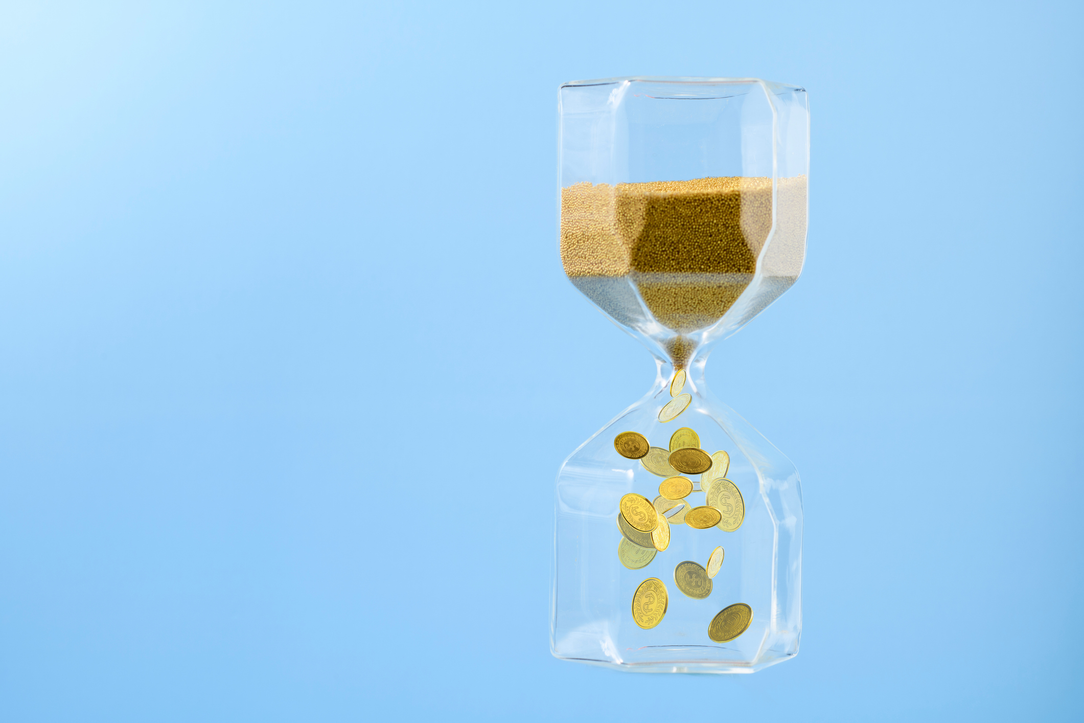 hourglass with golden sand flowing down become gold coins
