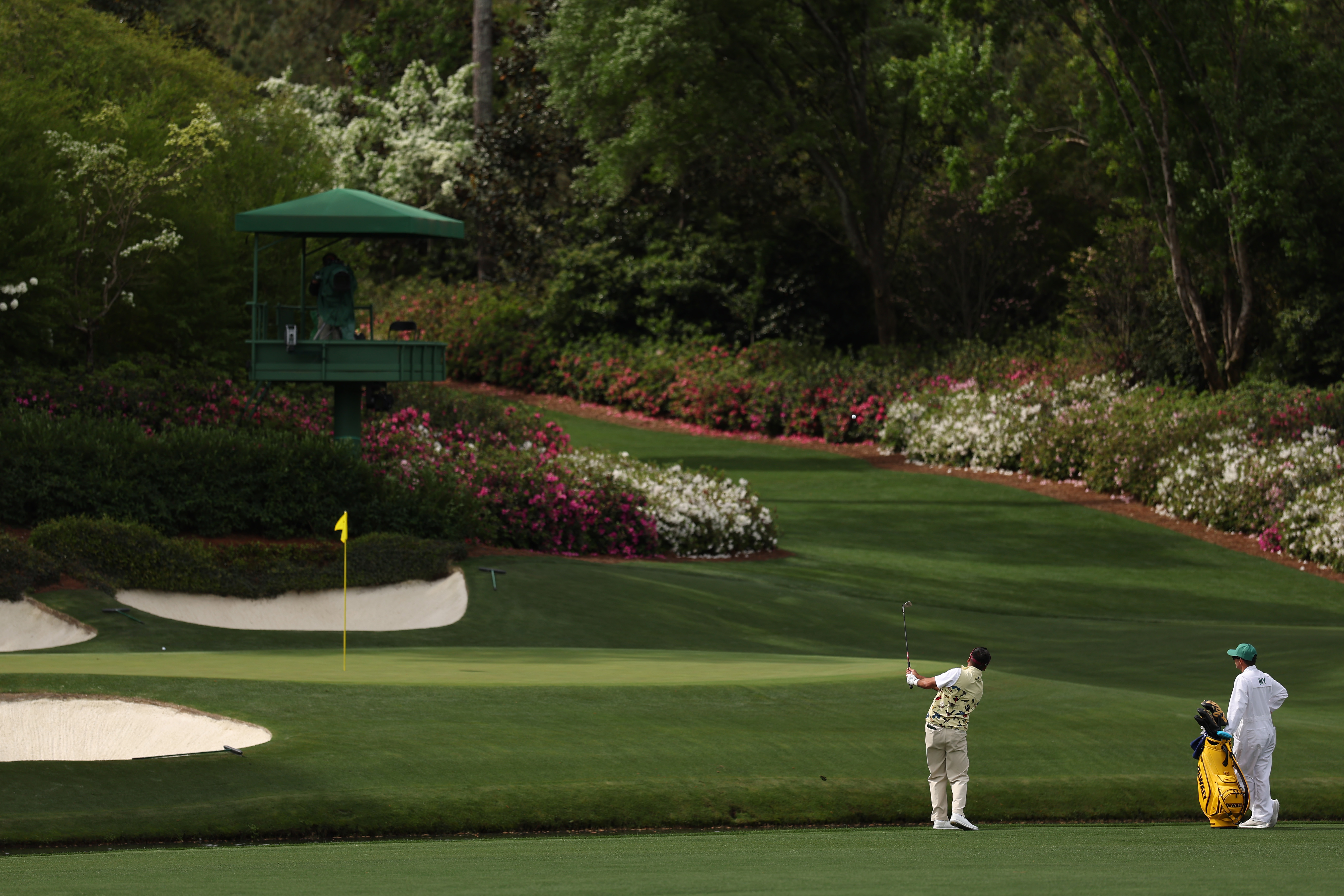 Jason Day strikes a shot from short of Rae's Creek