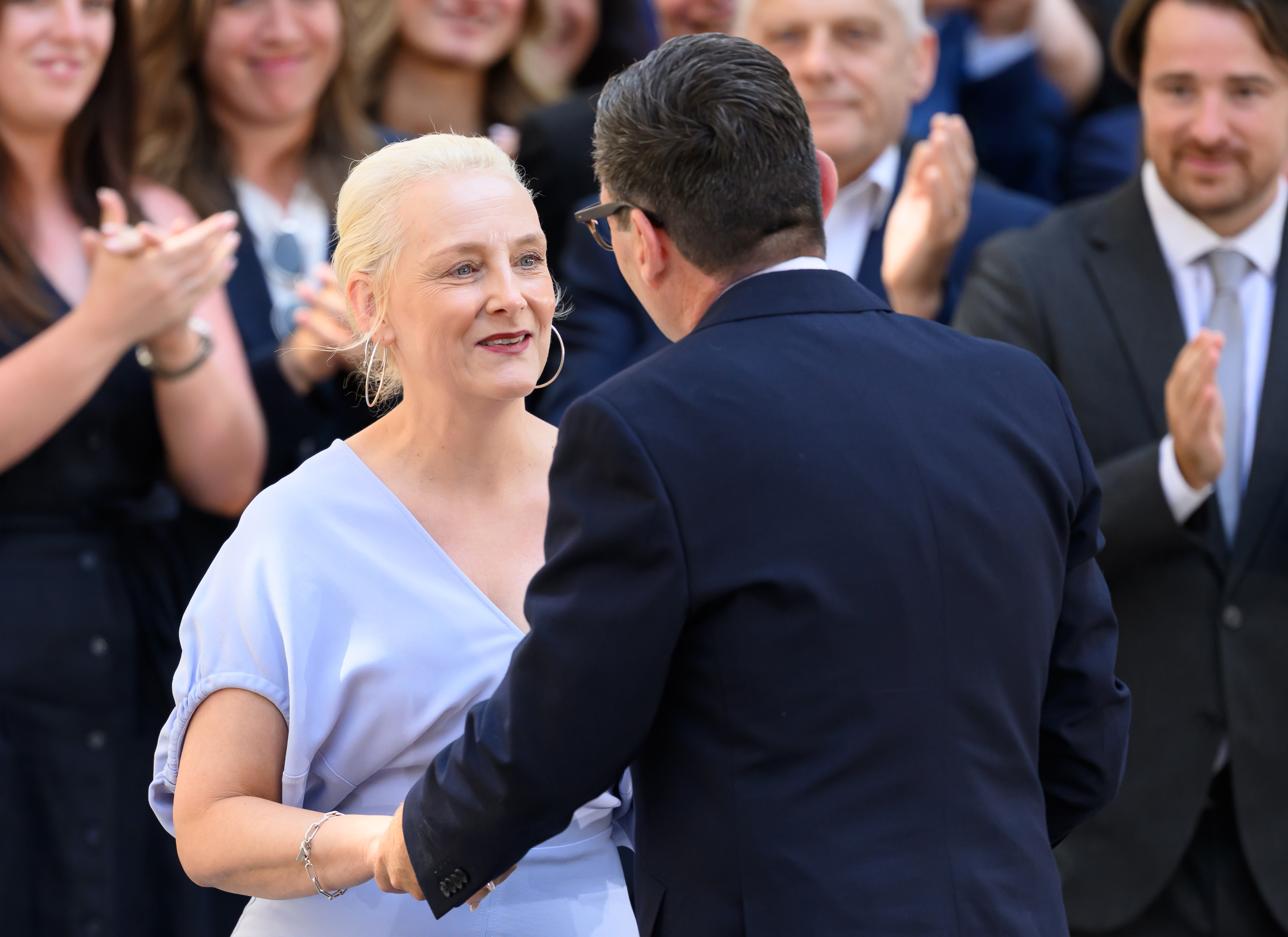 Marie-France van Heel in a lilac dress on the day Andy Burnham becomes Prime Minister