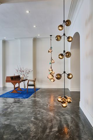 Filled with with natural light and equipped with an elegant staircase that connects the floors, the cool, minimal space is the perfect foil to the brand’s lighting
