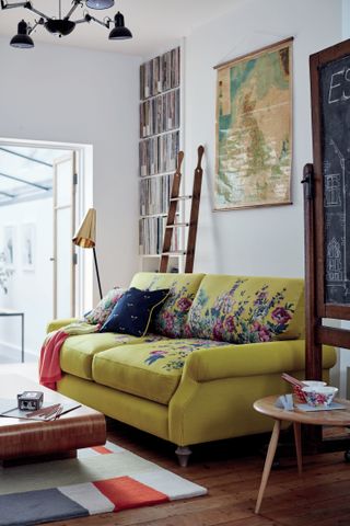 Floral yellow sofa in living room setting by DFS
