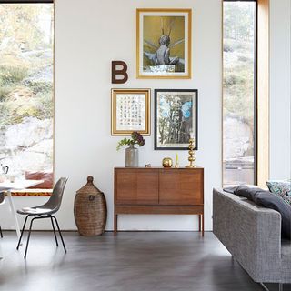 living room with photoframe on wall and flower in vase