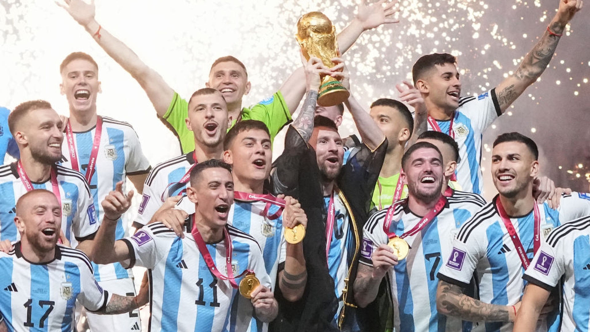 Lionel Messi of Argentina lifts the FIFA World Cup Trophy as he celebrates with team mates at the award ceremony following the FIFA World Cup Qatar 2022 ahead of the FIFA World Cup 2026