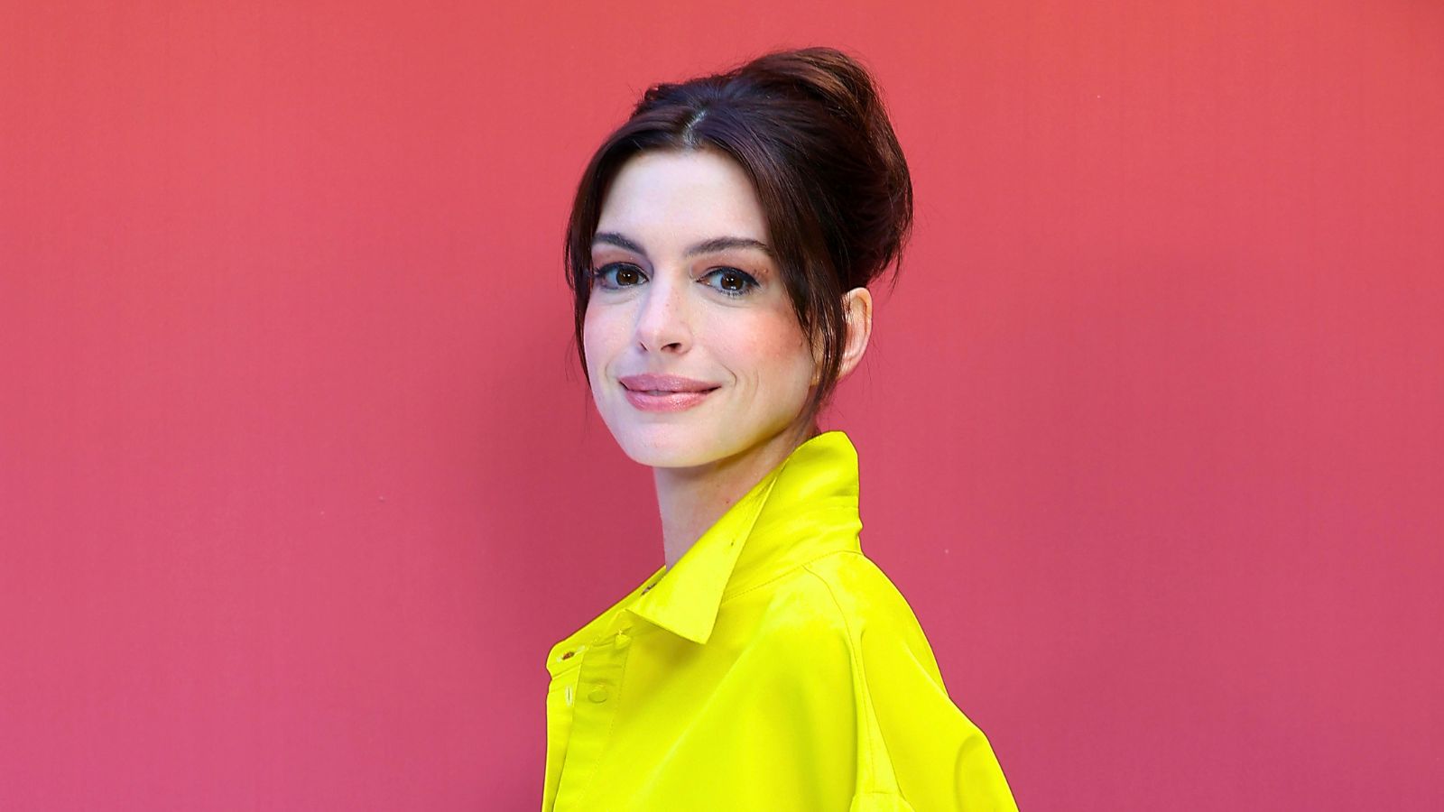 anne hatahway on a red background