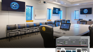 The Extron NAV Scaling Decoder in a conference room with multiple displays. 