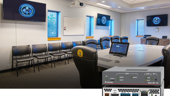 The Extron NAV Scaling Decoder in a conference room with multiple displays. 