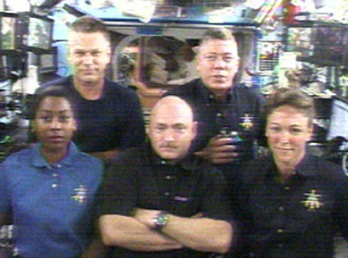 Eager Shuttle Crew Passes Spaceflight’s Halfway Mark