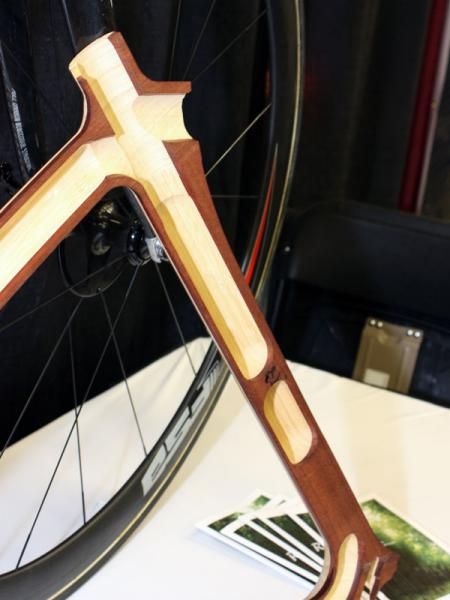 The inner and outer surfaces of each wooden blank are CNC-machined then the two halves are bonded together.