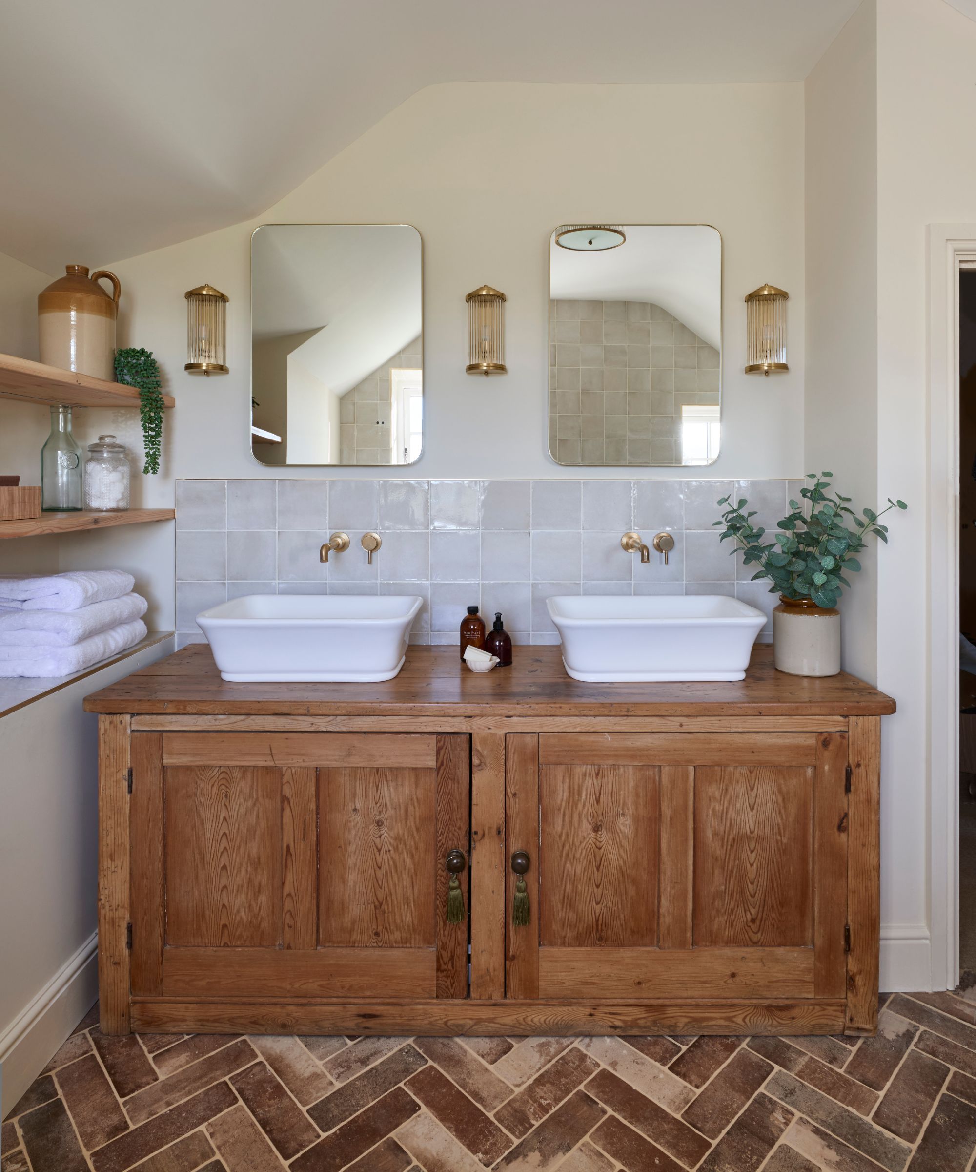 A neutral bathroom with a vintage dresser repurposed as a vanity
