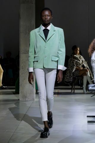 a Marni model walks the spring/summer 2025 runway in skinny pants