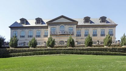 grand mansion house exterior with front lawn