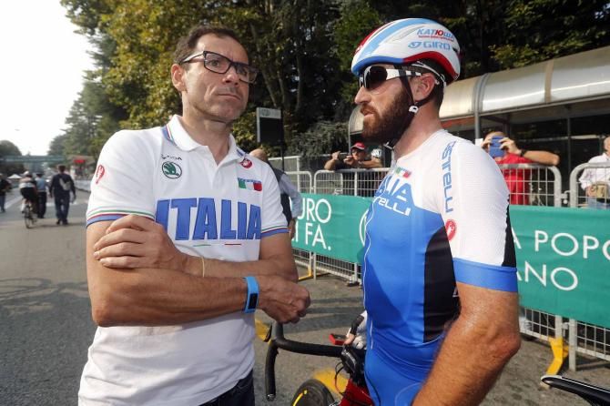 Italian coach Davide Cassani in conversation with Luca Paolini, who is helping out with the under-23 squad.
