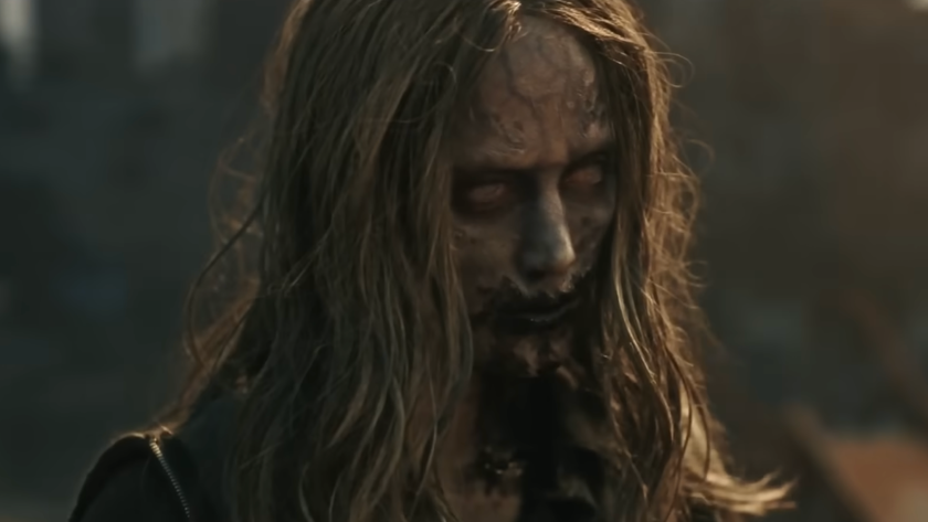 Maika Monroe is a zombie with black blood smeared across her mouth