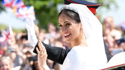 meghan markle on her wedding day wearing the bubble bath nail trend with her givenchy gown in an open air carriage