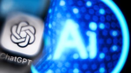 A photo taken on November 27, 2024 shows the logo of the ChatGPT application developed by US artificial intelligence research organization OpenAI on a smartphone screen (L) and the letters AI on a laptop screen in Frankfurt am Main, western Germany. (Photo by Kirill KUDRYAVTSEV / AFP) (Photo by KIRILL KUDRYAVTSEV/AFP via Getty Images)