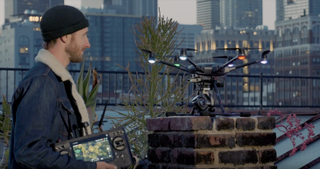 The Yuneec Typhoon H Plus drone being controlled by a remote pilot