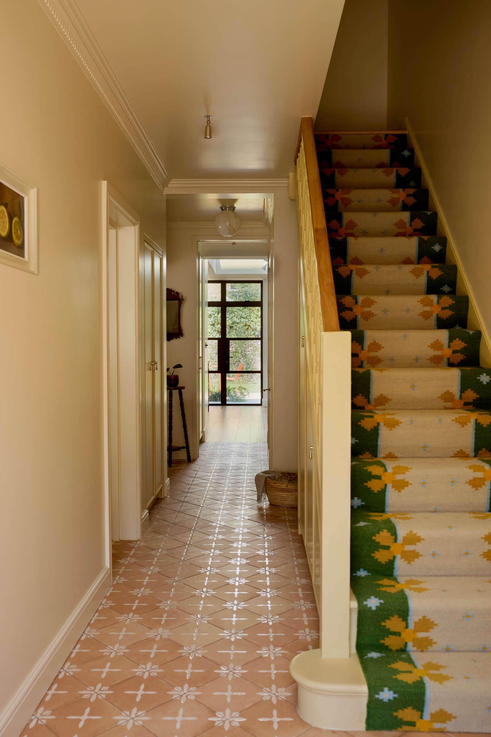 Edwardian hallway with tiled floor and colourful stair runner
