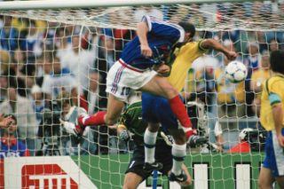 Zinedine Zidane scores France's first goal against Brazil in the 1998 World Cup final.