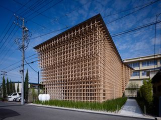 Exterior view of the GC Prostho Museum Research Centre in Kasugai which was constructed using wood creating a grid effect