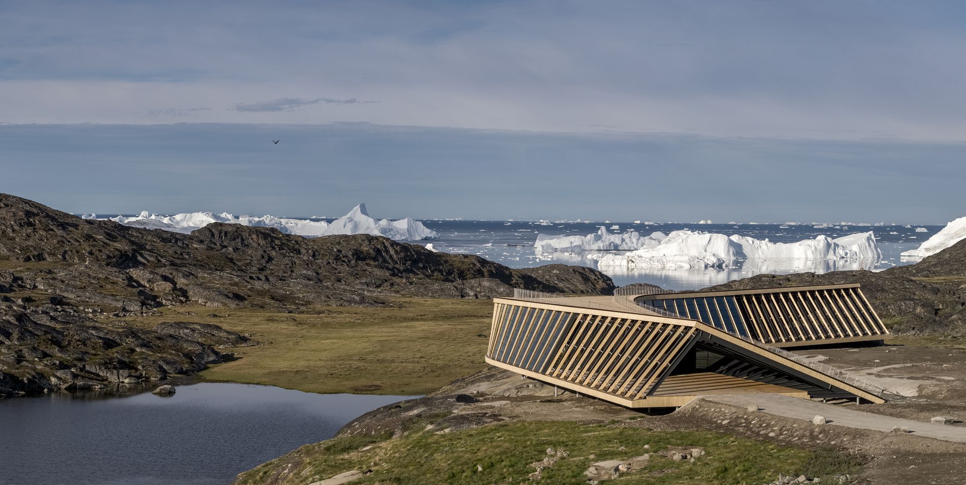 Ilulissat Icefjord Centre seen among craggy landscape