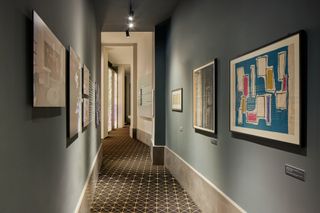 artworks in corridor at Brioni Milan store