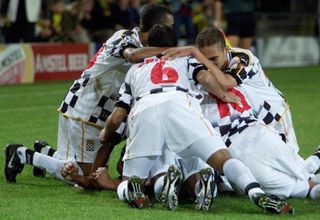 Boavista players celebrate a goal against Borussia Dortmund in the Champions League in October 2001.