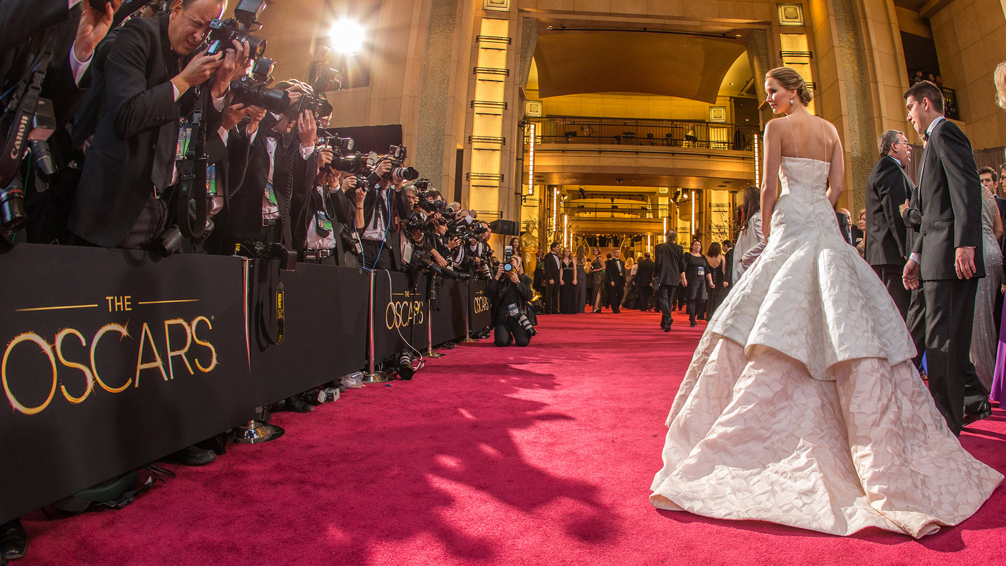 Jennifer Lawrence shows off the back of her long train on the red carpet during the 2013 Oscars (when she tripped up the stairs).