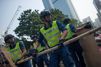 Hong Kong police dismantle protester barricades