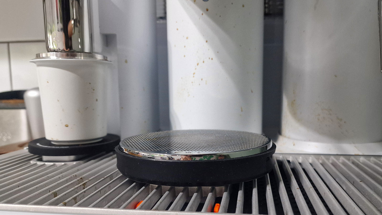 Meraki espresso machine with splatter of coffee