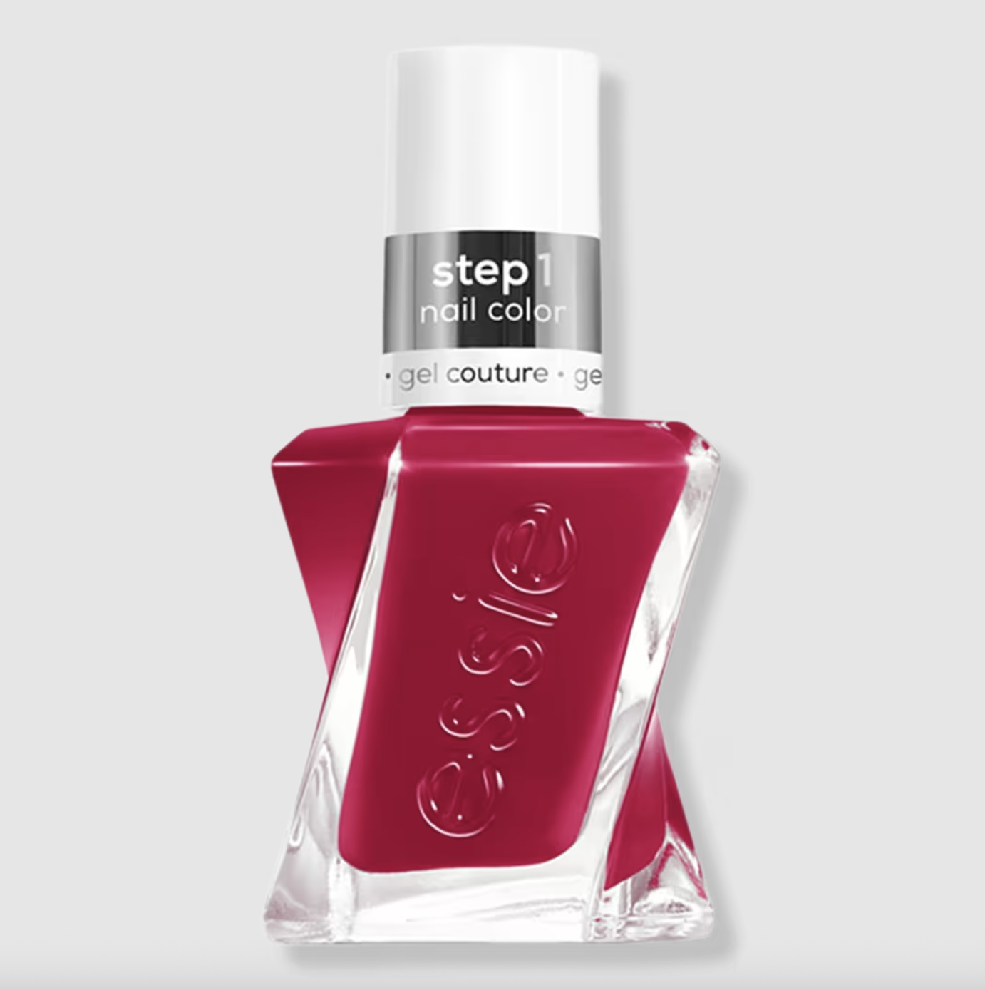 a bottle of magenta nail polish