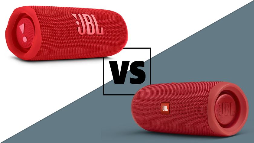 The JBL Flip 6 and Flip 5 speakers in red with a &#039;versus&#039; sign between them. The background is split diagonally: the left side is white, the right side grey.