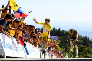 PLANCHE DES BELLES FILLES, FRANCE - JULY 08: (L-R) Tadej Pogacar of Slovenia and UAE Team Emirates - Yellow Leader Jersey celebrates at finish line as stage winner ahead of Jonas Vingegaard Rasmussen of Denmark and Team Jumbo - Visma during the 109th Tour de France 2022, Stage 7 a 176,3km stage from Tomblaine to La Super Planche des Belles Filles 1141m / #TDF2022 / #WorldTour / on July 08, 2022 in Planche des Belles Filles, France. (Photo by Tim de Waele/Getty Images)