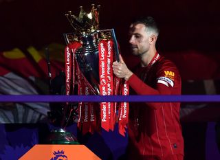 Henderson lifts the Premier League Trophy