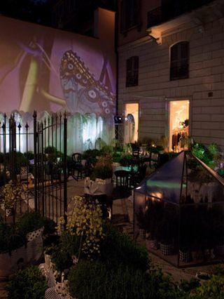 Marni The courtyard of Marni’s flagship boutique on Via della Spiga was transformed temporarily with a pop-up garden, with images of Lanterna Magica (spring) by artist Sara Rossi projected onto the walls each evening